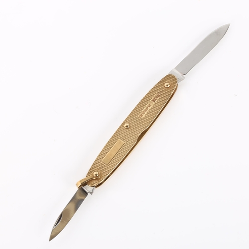 437 - A late 20th century 9ct gold penknife, allover engine turned decoration, makers marks SJR, hallmarks... 