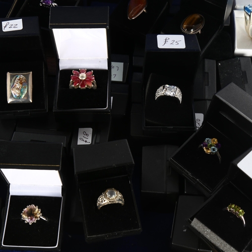 439 - A large quantity of modern silver stone set rings