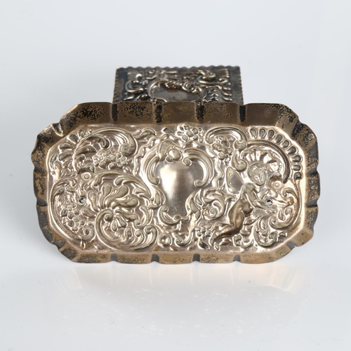 504 - A late Victorian silver upright matchbox holder, relief embossed foliate decoration with crimped tra... 