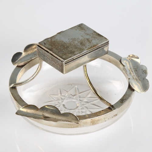 505 - An Edwardian silver-mounted glass combination ashtray/matchbox, circular form with star base, cigare... 