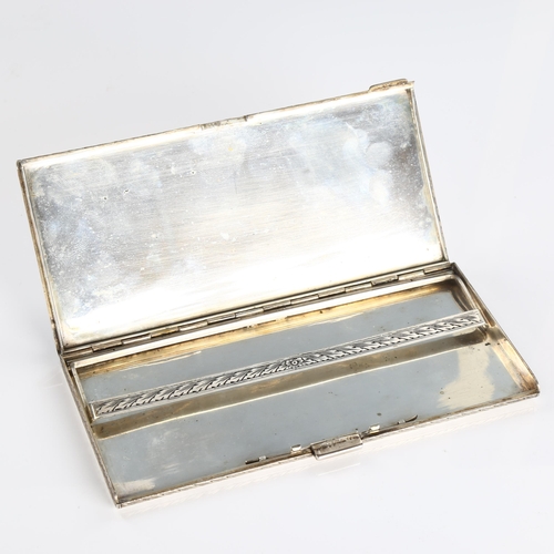 510A - A mid-20th Century Italian 800 silver cigarette case, allover engraved foliate decoration with centr... 