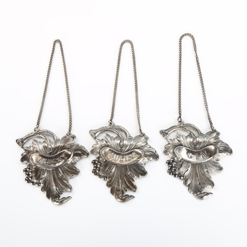 511 - A set of 3 Portuguese silver plated decanter labels, relief embossed leaf and grape design, comprisi... 