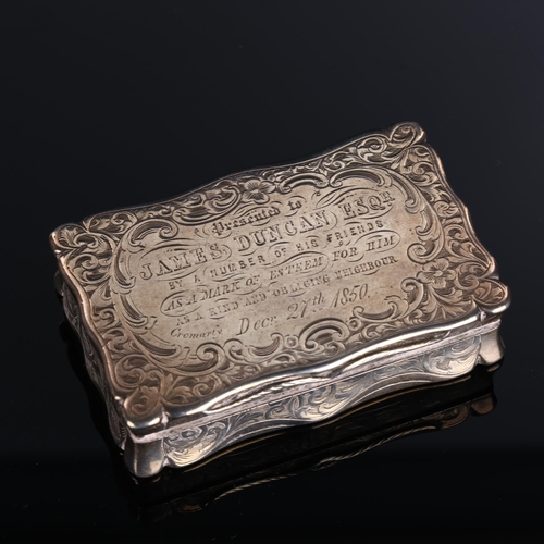 517 - A Victorian silver snuffbox, shaped rectangular form with allover foliate engraved decoration and gi... 