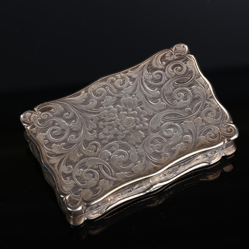 517 - A Victorian silver snuffbox, shaped rectangular form with allover foliate engraved decoration and gi... 