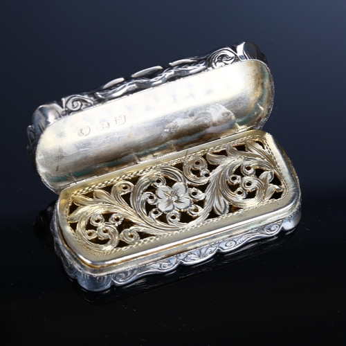 519 - A Victorian silver vinaigrette, shaped rectangular form with engraved and engine turned decoration, ... 