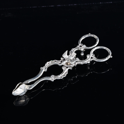 538 - A pair of 18th century Continental silver sugar nips, with bird pivot joint and original engraving d... 