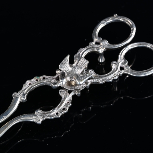 538 - A pair of 18th century Continental silver sugar nips, with bird pivot joint and original engraving d... 