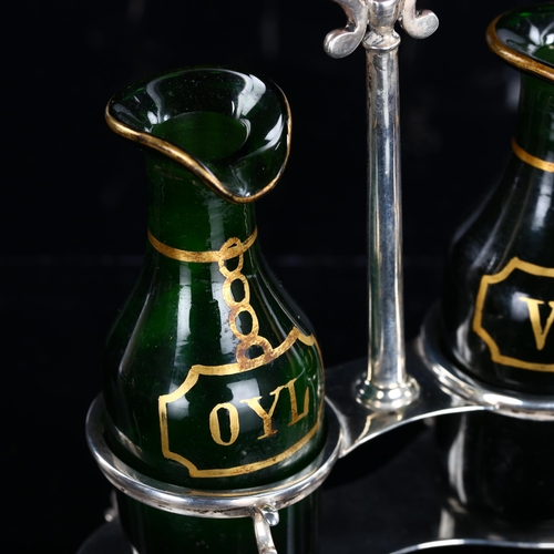 539 - A George V silver and green glass cruet set, with gilded glass bottles, named Oyl and Vinr, by Thoma... 