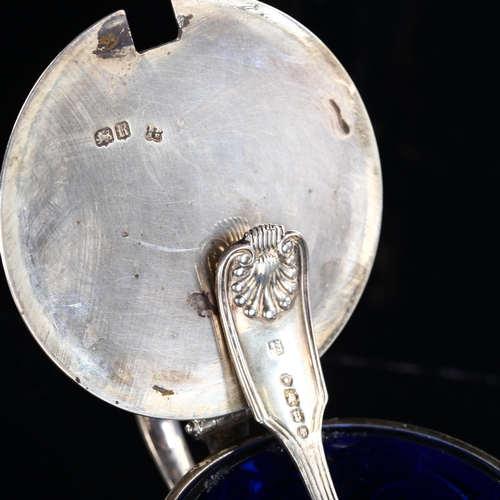 540 - A Victorian silver drum mustard pot and spoon, pierced foliate decoration with thumbpiece, blue glas... 