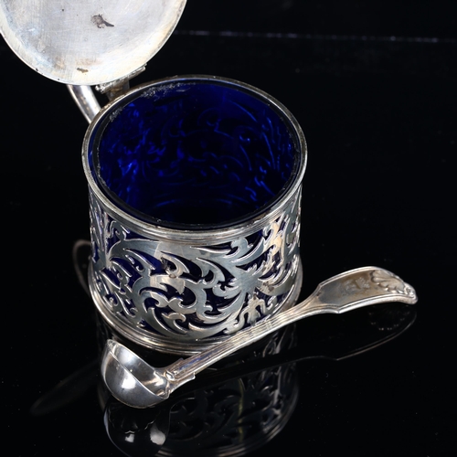 540 - A Victorian silver drum mustard pot and spoon, pierced foliate decoration with thumbpiece, blue glas... 