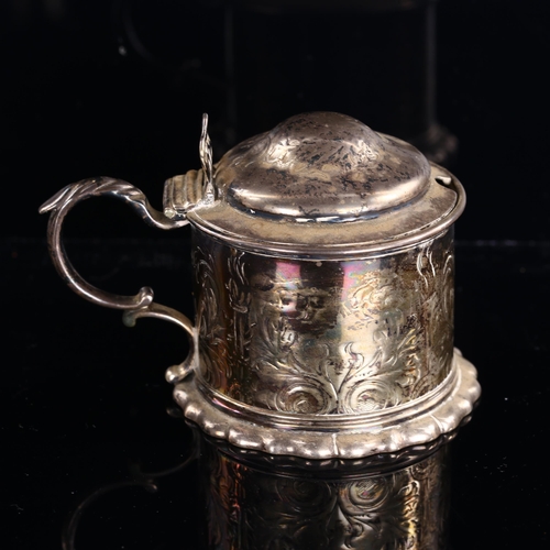 541 - A Victorian silver lidded tankard mustard pot, engraved foliate and flaming torch decoration with th... 