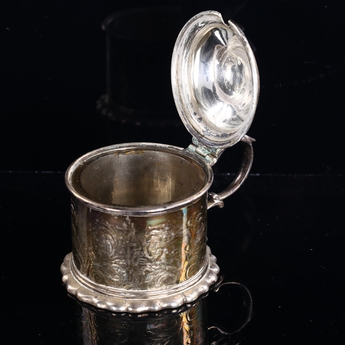 541 - A Victorian silver lidded tankard mustard pot, engraved foliate and flaming torch decoration with th... 