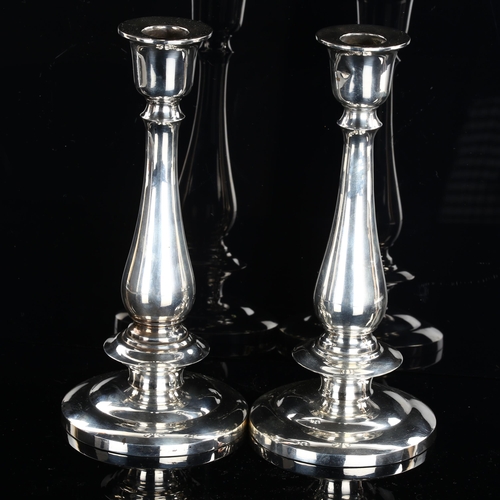 548 - A pair of Thai silver table candlesticks, baluster form with stepped circular base, stamped Thailand... 