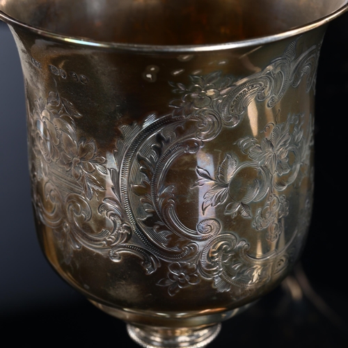 562 - A Victorian silver-gilt trophy goblet, engraved floral and foliate decoration with bead-edge, probab... 