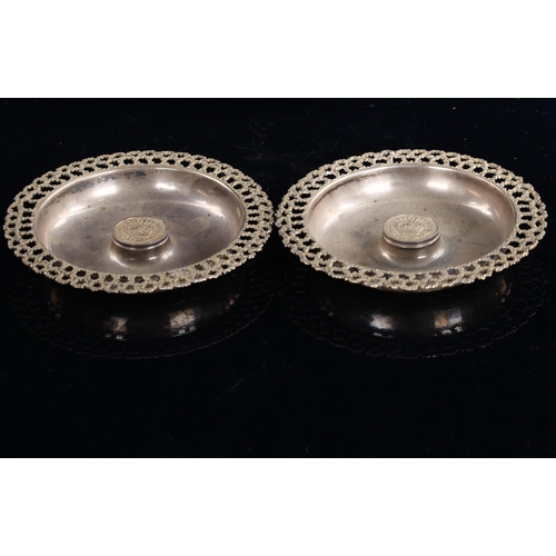 567 - STUART DEVLIN - a pair of Elizabeth II modernist silver and parcel-gilt Royal Silver Jubilee dishes,... 