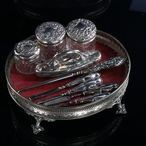 573 - Various silver dressing table items, including manicure and jars, and a silver plated dressing table... 