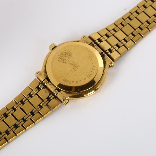 58 - GUCCI - a lady's gold plated 9200L quartz bracelet watch, black dial with gilt baton hour markers, s... 