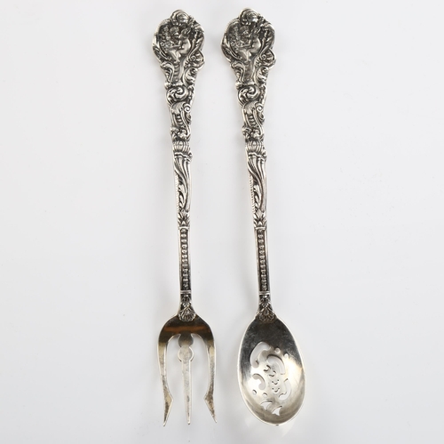 589 - *WITHDRAWN* GORHAM - an American sterling silver matching sifter spoon and fork, cast cherub decorat... 