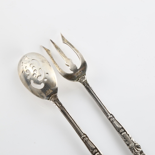 589 - *WITHDRAWN* GORHAM - an American sterling silver matching sifter spoon and fork, cast cherub decorat... 