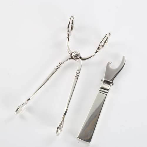 591 - GEORG JENSEN - a Danish sterling silver-handled bottle opener, and a pair of Danish sterling sugar t... 