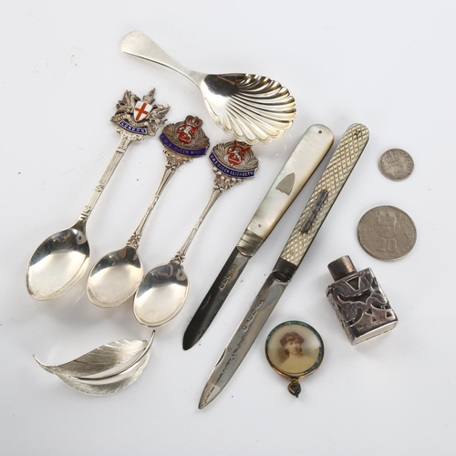 602 - Various silver, including tea caddy spoon, mother-of-pearl fruit knives, brooch etc