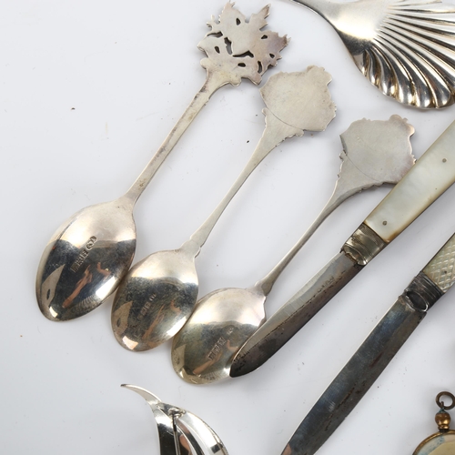 602 - Various silver, including tea caddy spoon, mother-of-pearl fruit knives, brooch etc