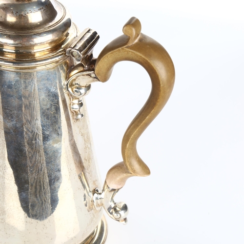 614 - A George II silver coffee pot, tapered cylindrical form with turned wood handle and scrolled acanthu... 