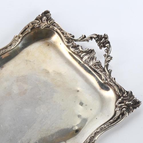 616 - A 19th century French silver 2-handled dressing table tray, rectangular form with cast foliate rim, ... 