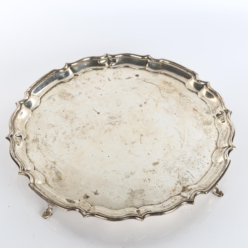 617 - A George V circular silver salver, scalloped rim with hoof feet, by Barker Brothers Silver Ltd, Jubi... 