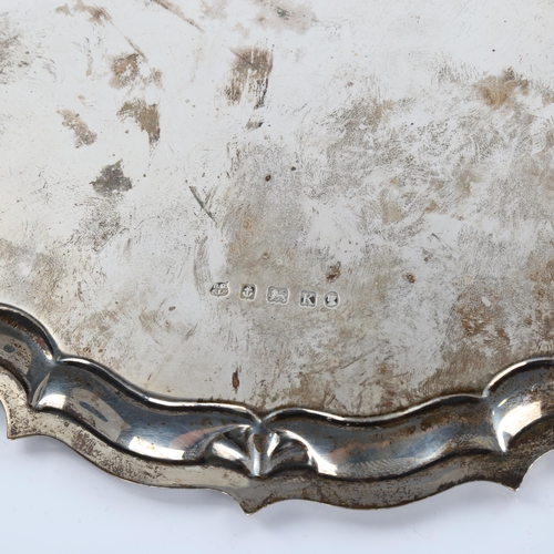 617 - A George V circular silver salver, scalloped rim with hoof feet, by Barker Brothers Silver Ltd, Jubi... 