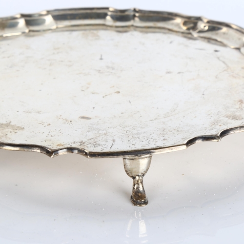 617 - A George V circular silver salver, scalloped rim with hoof feet, by Barker Brothers Silver Ltd, Jubi... 