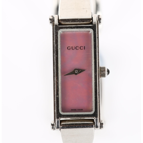 62 - GUCCI - a lady's stainless steel 1500L quartz bracelet watch, pink mother-of-pearl dial with cabocho... 