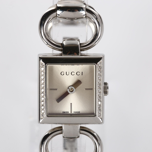 66 - GUCCI - a lady's stainless steel Tornabuoni quartz bracelet watch, ref. 120, silvered dial with diam... 