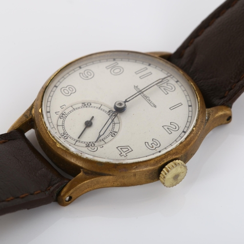 6 - JAEGER LE COULTRE - a Vintage gold plated stainless steel mechanical wristwatch, circa 1950s, silver... 