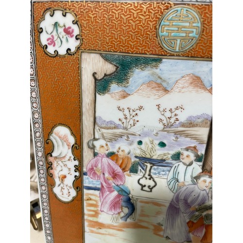 1067 - A Chinese rectangular porcelain plaque, hand painted detailed interior scenes depicting a family and... 
