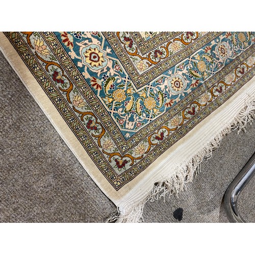 1129 - A Turkish handmade silk rug, 173cm x 108cm