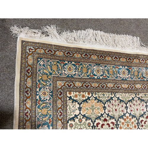 1129 - A Turkish handmade silk rug, 173cm x 108cm