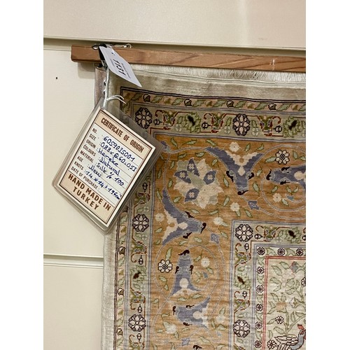 1131 - A Turkish handmade silk rug, 88cm x 60cm