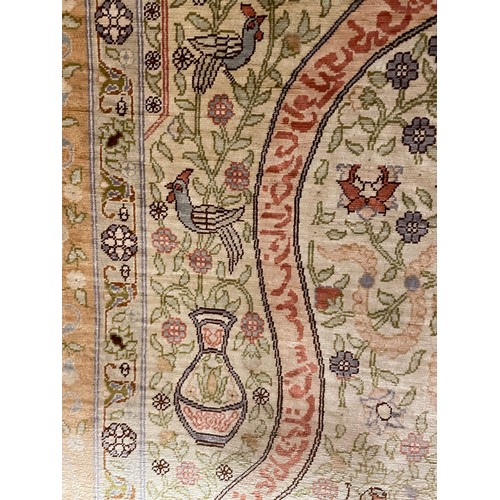 1131 - A Turkish handmade silk rug, 88cm x 60cm