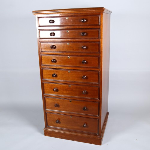 1029 - A good quality 19th century mahogany narrow chest of 8 drawers, with moulded drawer fronts and turne... 