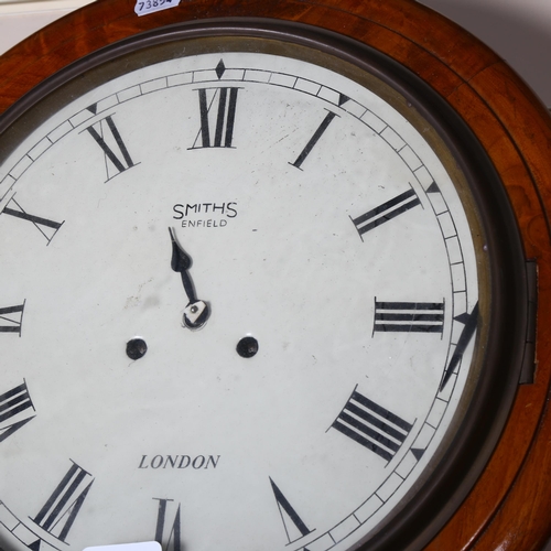 102 - An early 20th century Smiths Enfield mahogany-cased 8-day circular dial wall clock, overall diameter... 