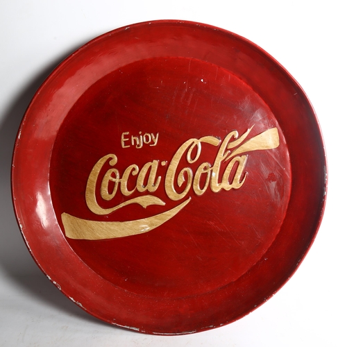 108 - A modern painted aluminium circular tray, embossed Coca Cola, diameter 53cm
