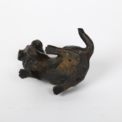 119 - A small patinated bronze figural dog sculpture, indistinctly signed, height 6cm