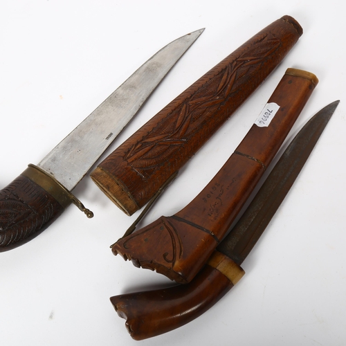 130 - 2 Indian daggers, with hardwood sheaths, largest length 30cm (2)