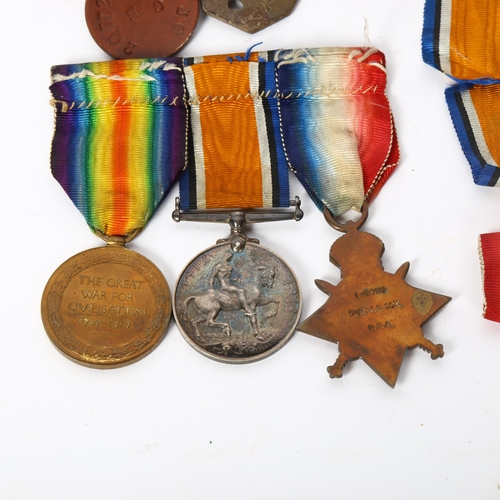141 - A set of 3 First World War Service medals, to L-20112 Gunner J G Cox Royal Artillery, associated dog... 