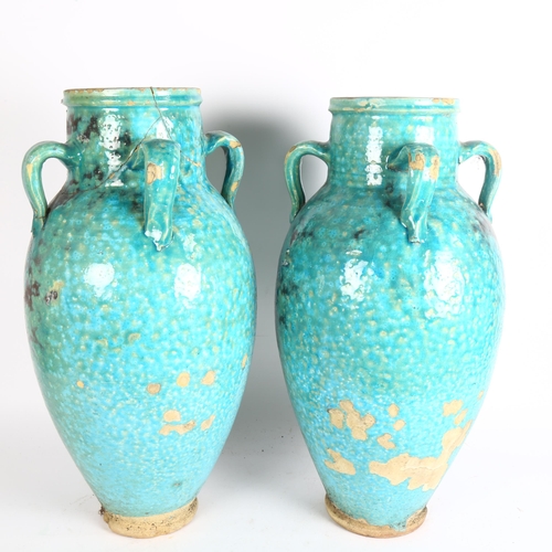 195 - A pair of large Hamadan turquoise glaze pottery oil jars (1 A/F), height 54cm