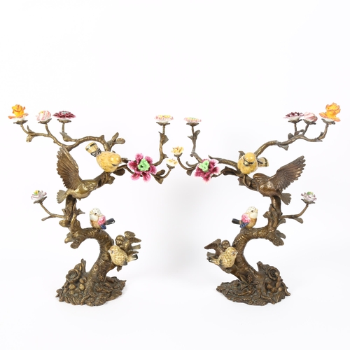2 - A pair of Art Nouveau French bronze and porcelain 'birds on branch' sculptures, with hand painted po... 