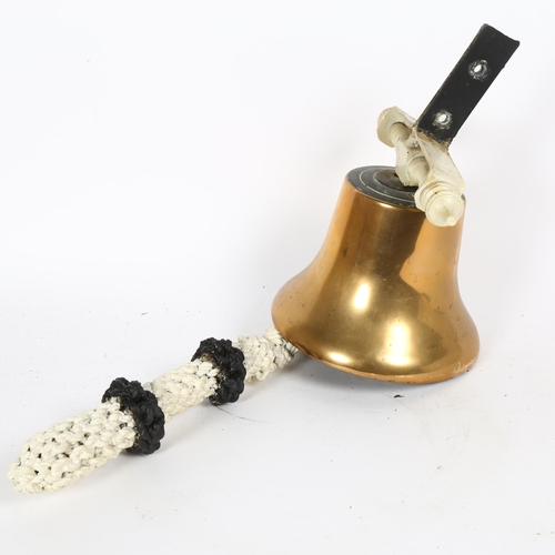 21 - A polished bronze bell, with mount and painted rope-handled clapper, unmarked, diameter 19cm
