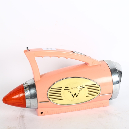 242 - WING LIGHT - a Vintage pink Cadillac Wing Light radio