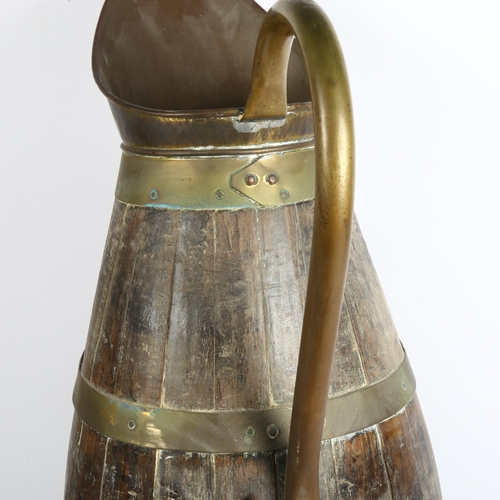 244 - A French oak coopered jug, height 60cm